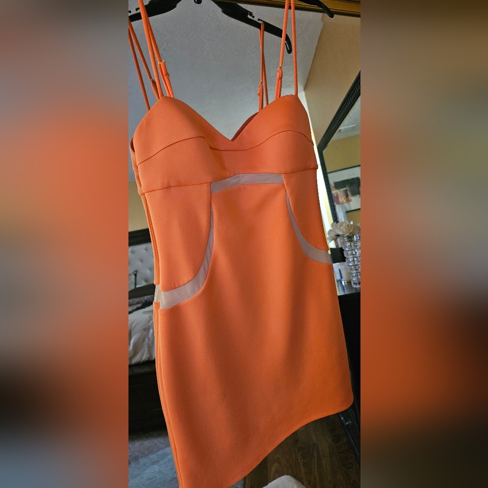 Bebe fitted orange color evening dress